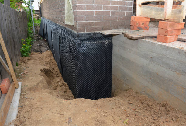 SJ Waterproofing Pros technician performing targeted Exterior Waterproofing assessment in Economy, IN